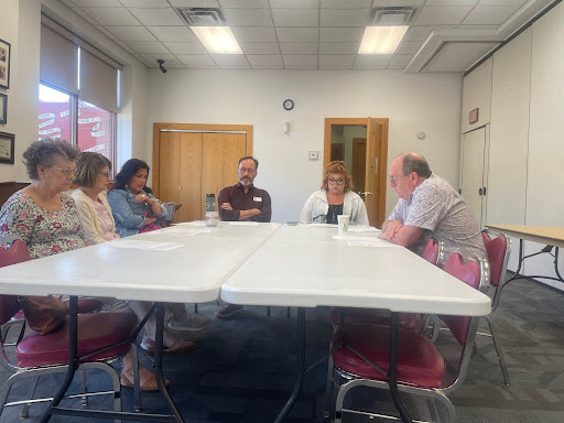 Library board president, Nick, and Hannah in NPL board room